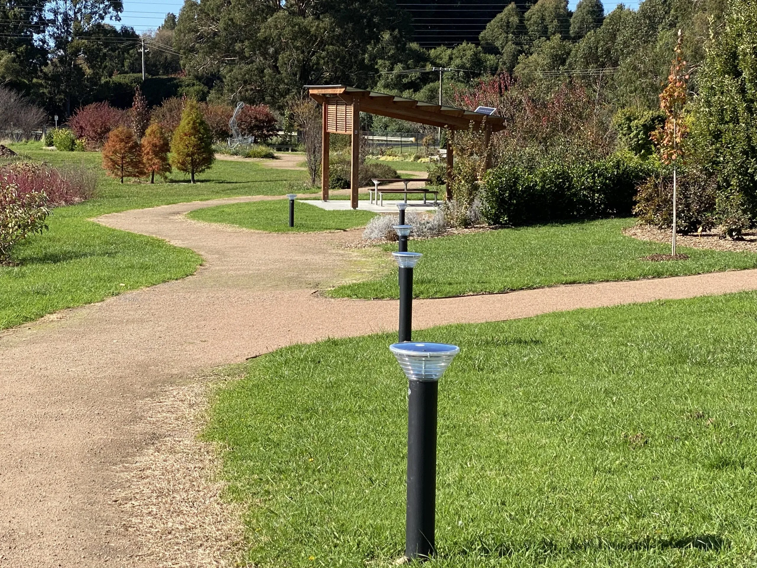 Solar bollard lights at walkway